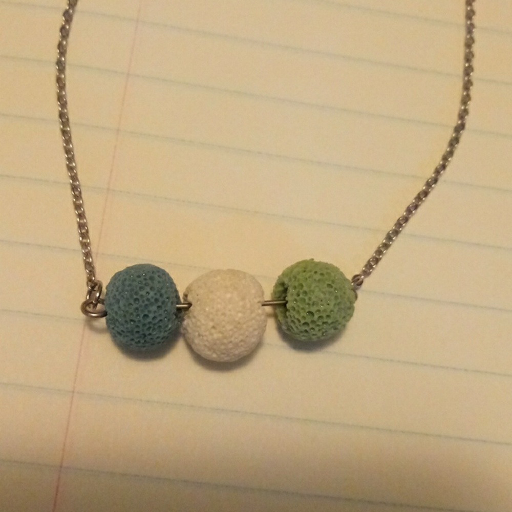 There are 2 lava rock necklaces